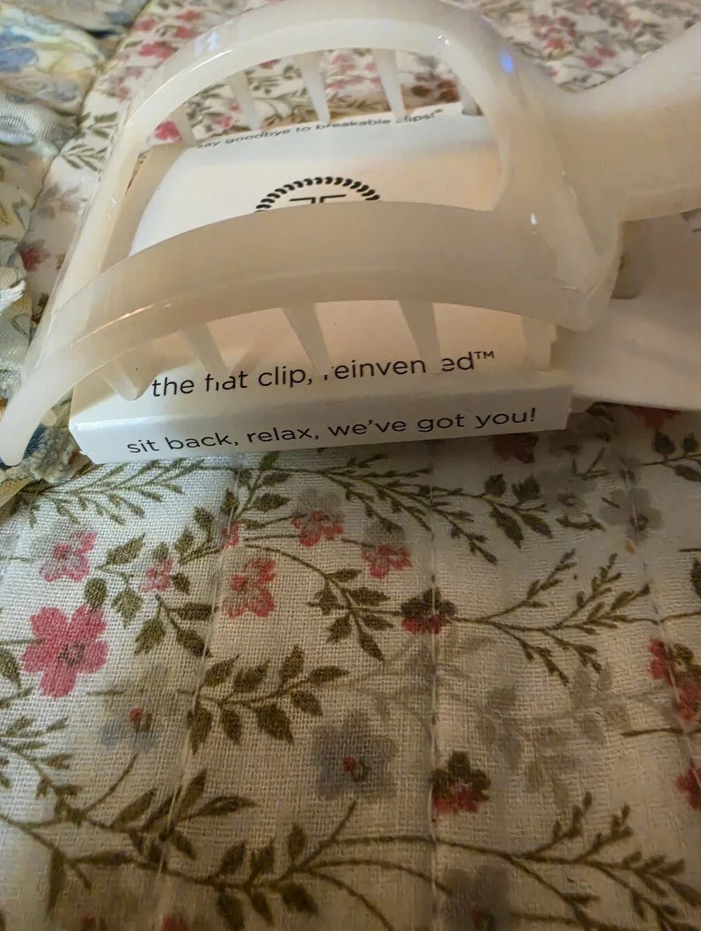 Coconut white plastic hair clip.